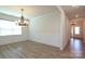 Formal dining room featuring wainscoting, decorative chandelier and wood flooring at 309 Kentmere Ln, Clover, SC 29710