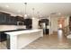 Bright, open kitchen with stainless steel appliances, island, and modern dark cabinetry with great flow at 309 Kentmere Ln, Clover, SC 29710