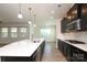 Beautiful kitchen with stainless steel appliances, large island, and adjacent living area with natural light at 309 Kentmere Ln, Clover, SC 29710
