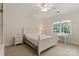 A serene bedroom features a white wooden bed, a window with a view, and a desk for studying at 3314 Leamington Ln, Charlotte, NC 28226