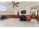 Large bonus room features a skylight, a mounted TV, and flexible space for various activities at 3314 Leamington Ln, Charlotte, NC 28226