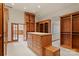Well-organized walk-in closet featuring custom wood shelving, drawers, and ample storage options at 3314 Leamington Ln, Charlotte, NC 28226