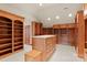 A large closet with custom wood shelving offers ample storage space and organization options at 3314 Leamington Ln, Charlotte, NC 28226