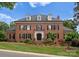 Beautiful brick home with dormers, black shutters, and a well-kept lawn at 3314 Leamington Ln, Charlotte, NC 28226