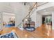 Grand foyer with hardwood floors, a staircase, chandelier, and views into the dining room at 3314 Leamington Ln, Charlotte, NC 28226