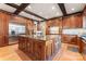 Spacious kitchen with wood cabinets, large island, and stainless steel appliances at 3314 Leamington Ln, Charlotte, NC 28226