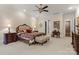 Bright main bedroom with ensuite access, sitting area, and designer furniture at 3314 Leamington Ln, Charlotte, NC 28226