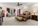 Spacious main bedroom with decorative windows, elegant furnishings, and plush carpeting at 3314 Leamington Ln, Charlotte, NC 28226
