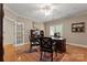 An elegant home office boasts hardwood floors, a detailed desk, and refined furnishings, perfect for productivity at 3314 Leamington Ln, Charlotte, NC 28226