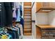 Organized walk-in closet with hanging rods, shelves, and a built-in dresser for storage at 3314 Leamington Ln, Charlotte, NC 28226