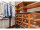 Custom walk-in closet with shelving and drawers for organizing clothes and accessories at 3314 Leamington Ln, Charlotte, NC 28226