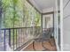 Relaxing balcony with metal chairs and serene views of surrounding trees at 3508 Mountain Cove Dr, Charlotte, NC 28216