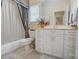 Bright bathroom with a white vanity, ample storage, and a shower with curtain at 3508 Mountain Cove Dr, Charlotte, NC 28216