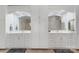 Well-lit bathroom with double vanities, plenty of cabinets, and tiled floors at 3508 Mountain Cove Dr, Charlotte, NC 28216