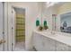 Well-lit bathroom featuring a white vanity, ample counter space, and a separate shower area at 3508 Mountain Cove Dr, Charlotte, NC 28216