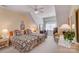 Bright bedroom features dual beds with floral quilts, a desk space, and natural light at 3508 Mountain Cove Dr, Charlotte, NC 28216