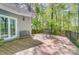 Spacious deck overlooking a serene, wooded area with outdoor seating for relaxing or entertaining at 3508 Mountain Cove Dr, Charlotte, NC 28216