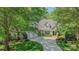 Charming two-story home featuring a three-car garage, well-manicured lawn, and lush landscaping at 3508 Mountain Cove Dr, Charlotte, NC 28216