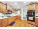 Functional kitchen with wood cabinetry, built-in oven, cooktop, and ample counter space, ideal for cooking and entertaining at 3508 Mountain Cove Dr, Charlotte, NC 28216