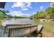 Breathtaking lake view with private dock and boat access, providing endless opportunities for water activities at 3508 Mountain Cove Dr, Charlotte, NC 28216