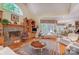 Spacious living room featuring a fireplace, hardwood floors, and multiple seating areas at 3508 Mountain Cove Dr, Charlotte, NC 28216