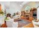 Bright living room with vaulted ceilings, a stone fireplace, and large windows providing natural light at 3508 Mountain Cove Dr, Charlotte, NC 28216