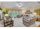 Spacious living room with large windows, plush seating, fireplace, and elegant decor, perfect for relaxation and entertaining at 3508 Mountain Cove Dr, Charlotte, NC 28216