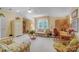 Inviting living room with plenty of natural light, comfortable seating, and a functional desk area at 3508 Mountain Cove Dr, Charlotte, NC 28216