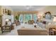 Bright living room with large windows, neutral-toned furnishings, fireplace, and classic design elements at 3508 Mountain Cove Dr, Charlotte, NC 28216
