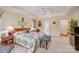 Comfortable main bedroom features a bed with floral bedding, a desk, and natural light at 3508 Mountain Cove Dr, Charlotte, NC 28216