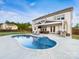 Backyard features an outdoor living area with comfortable seating, dining set, outdoor kitchen, and a refreshing pool at 405 Winding Oaks Se Ln, Concord, NC 28025