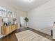 Bright bedroom with decor, an area rug, hardwood floors and a shiplap accent wall at 405 Winding Oaks Se Ln, Concord, NC 28025