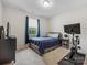 Cozy bedroom with plush carpeting, natural light from the window, and a neutral color palette for a calming atmosphere at 405 Winding Oaks Se Ln, Concord, NC 28025