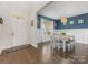 Inviting dining room with stylish decor, a large window, and hardwood floors at 405 Winding Oaks Se Ln, Concord, NC 28025