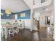 Charming dining area with stylish decor, hardwood floors, and a view into the adjacent foyer at 405 Winding Oaks Se Ln, Concord, NC 28025
