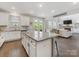 Kitchen with granite countertops, stainless steel appliances, and breakfast bar seating at 405 Winding Oaks Se Ln, Concord, NC 28025