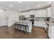 Bright kitchen with stainless appliances, granite countertops and breakfast bar seating at 405 Winding Oaks Se Ln, Concord, NC 28025