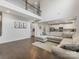 Open concept living room with view of kitchen, hardwood floors and staircase at 405 Winding Oaks Se Ln, Concord, NC 28025