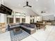 Inviting outdoor space featuring a modern patio with a comfortable lounge area, dining set, and outdoor kitchen at 405 Winding Oaks Se Ln, Concord, NC 28025