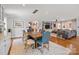Open-concept dining area flows into the living room, featuring a large wooden table at 4147 Chelmsford Rd, Charlotte, NC 28211