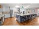 Spacious kitchen features a large island with seating and stainless steel appliances at 4147 Chelmsford Rd, Charlotte, NC 28211