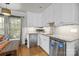 Efficient kitchenette with stainless steel appliances, granite countertops, and white cabinetry at 4147 Chelmsford Rd, Charlotte, NC 28211