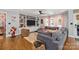 Spacious living room featuring a comfortable sectional sofa, built-in shelving, and stylish decor at 4147 Chelmsford Rd, Charlotte, NC 28211