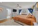 Bright primary bedroom featuring a TV, ensuite bathroom and large windows at 4147 Chelmsford Rd, Charlotte, NC 28211