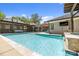 Inviting backyard pool with pergola, outdoor seating, and lush landscaping at 4147 Chelmsford Rd, Charlotte, NC 28211