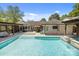 Beautiful backyard oasis with pool, outdoor seating, and covered dining area at 4147 Chelmsford Rd, Charlotte, NC 28211