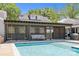 Inviting pool area with pergola, comfortable seating, and well-manicured landscaping at 4147 Chelmsford Rd, Charlotte, NC 28211