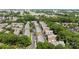 Aerial view of townhome community surrounded by trees and cityscape, showcasing the neighborhood's location at 4941 S Hill View Dr, Charlotte, NC 28210