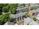 Aerial view of updated townhomes with private garages, set in a lush, tree-filled neighborhood at 4941 S Hill View Dr, Charlotte, NC 28210