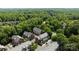 Overhead view of a lovely townhome community surrounded by lush greenery and mature trees, creating a peaceful setting at 4941 S Hill View Dr, Charlotte, NC 28210